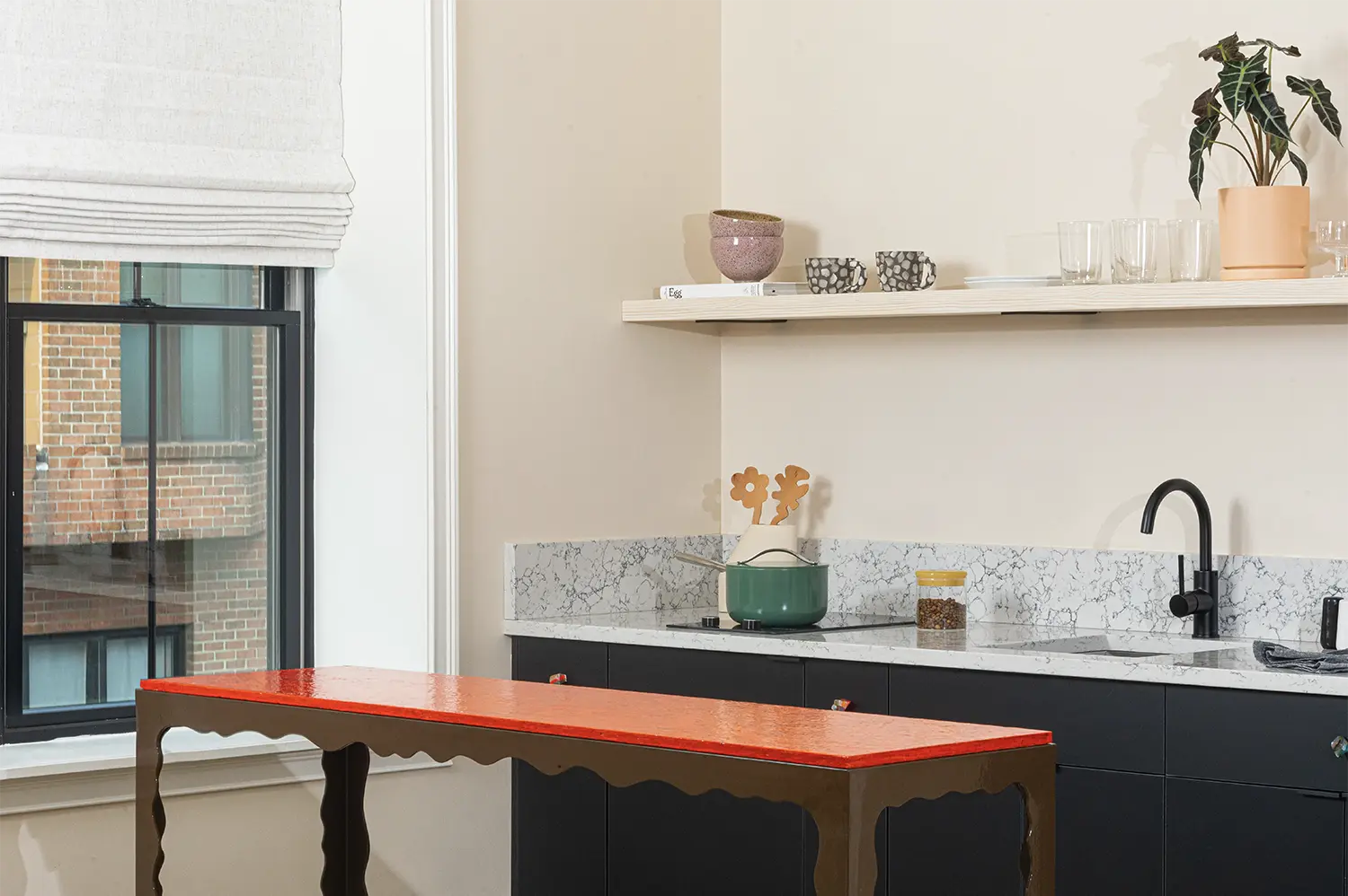 Marble kitchen counter on a side of a medium size window