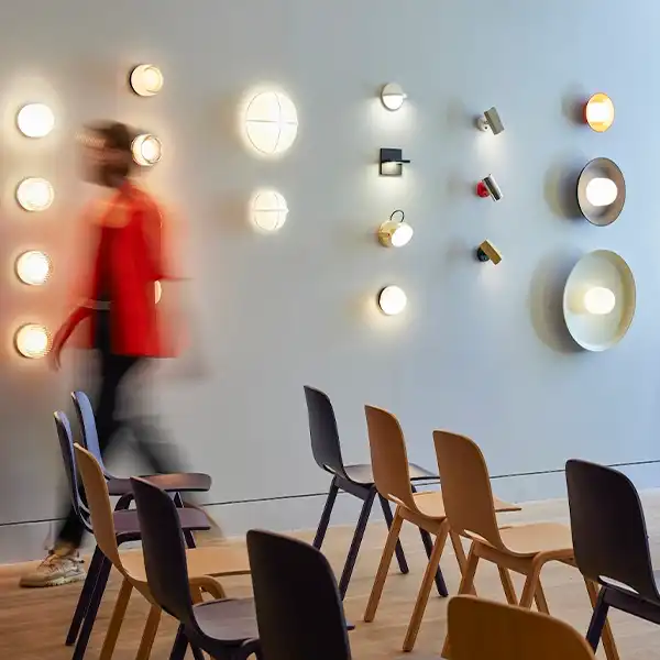 room in which a man is seen walking quickly