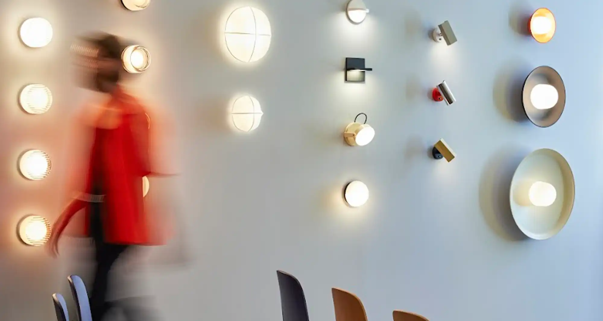 room in which a man is seen walking quickly