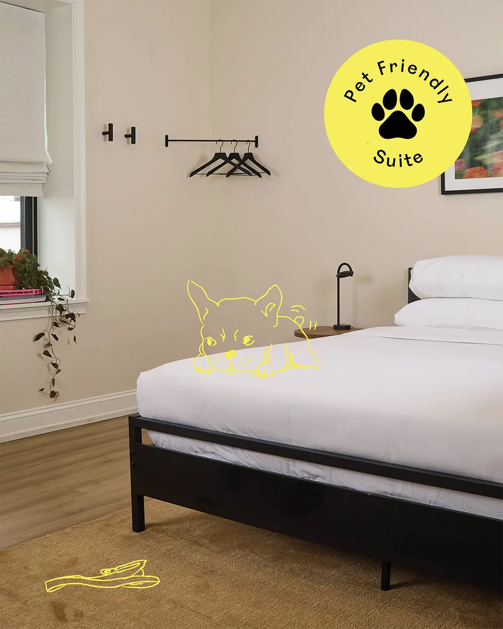 bedroom with a double bed with white bed sheets, a window frame whit a small plant, a picture on the wall and a yellow stamp with the text 