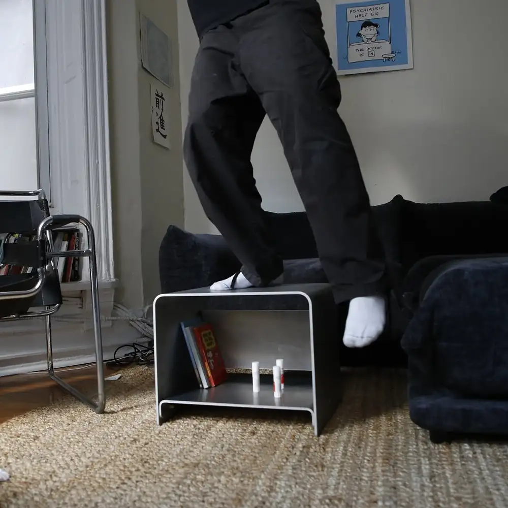 man standing on an armchair