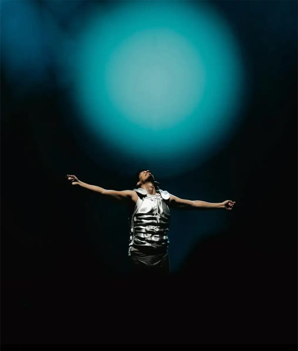man under green light