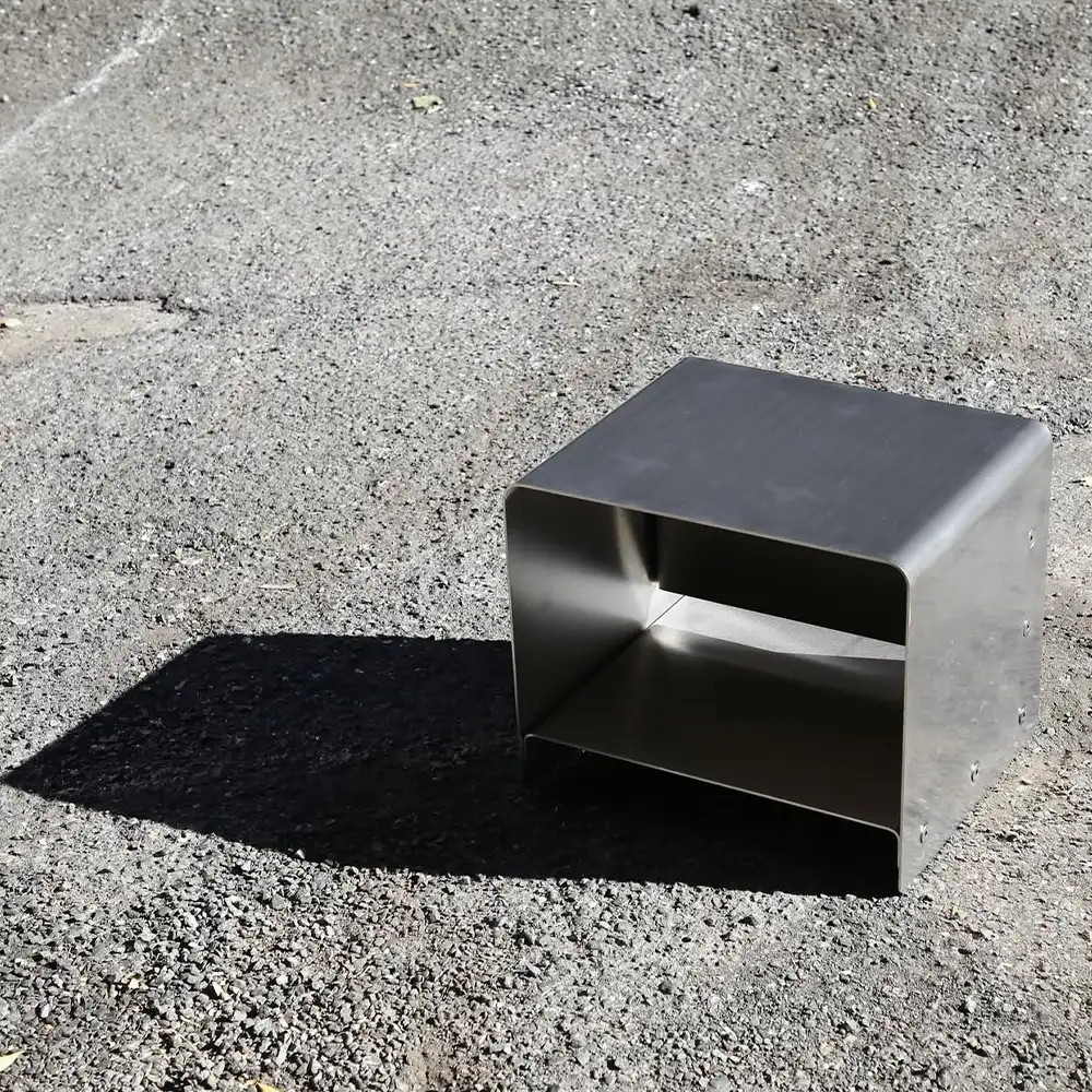 metal armchair in the middle of the street