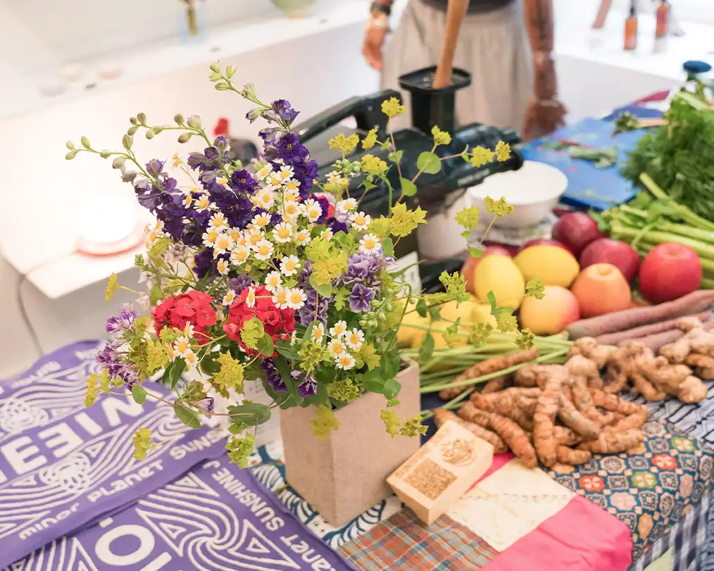 table full of flowers and food