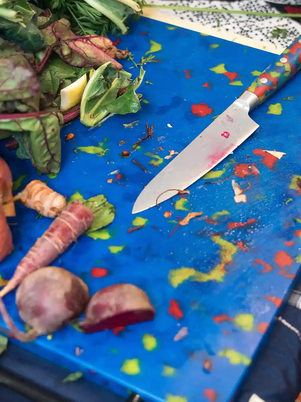 photograph of some vegetables on a blue board