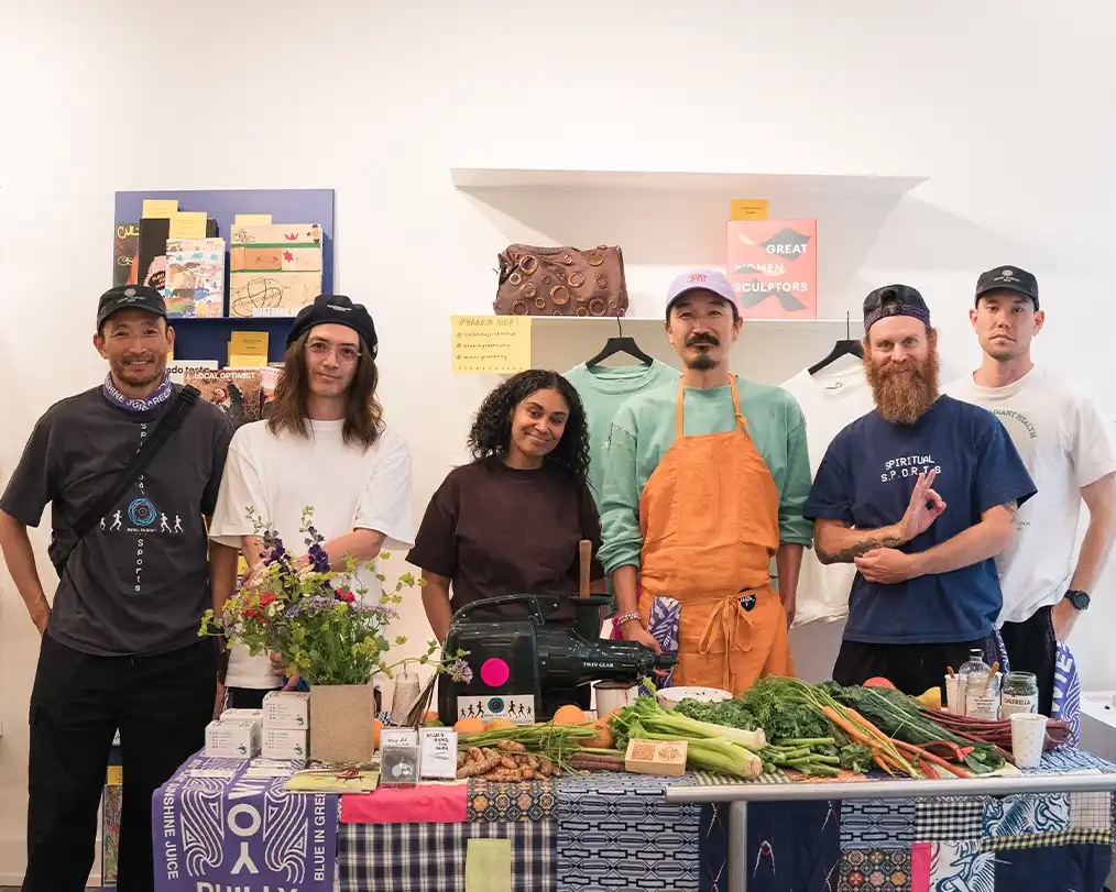 six people posing and smiling at the camera