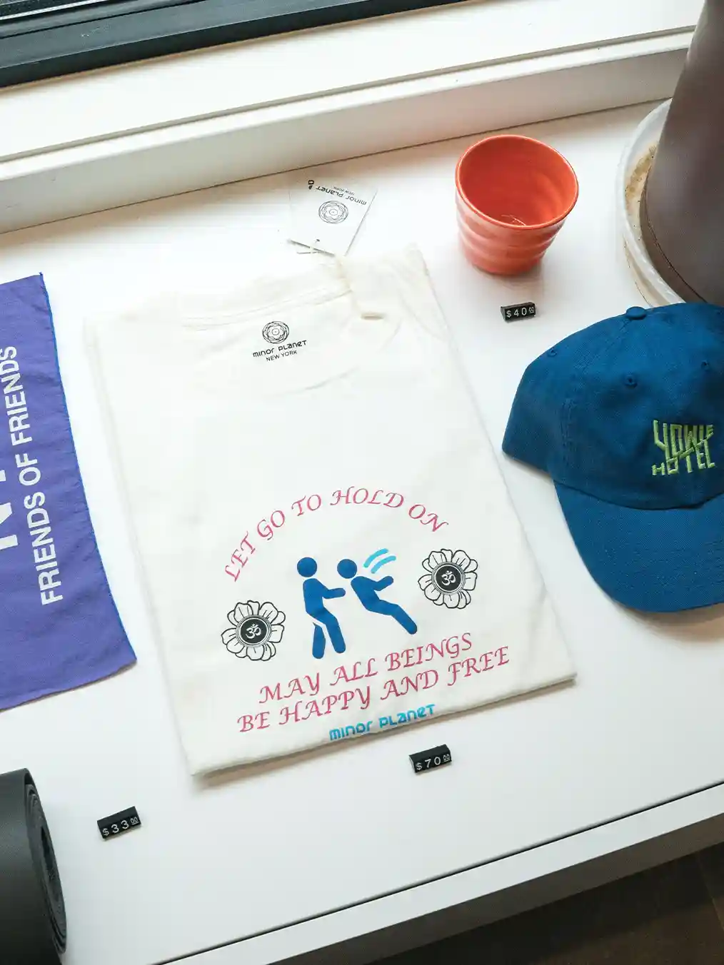white t-shirt with blue embroidery