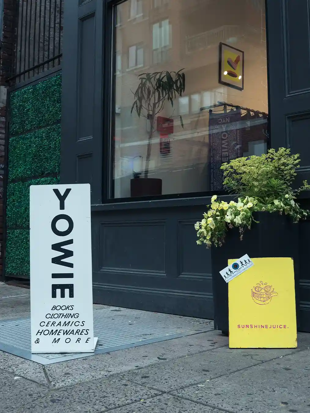 white Yowie sign in front of a store