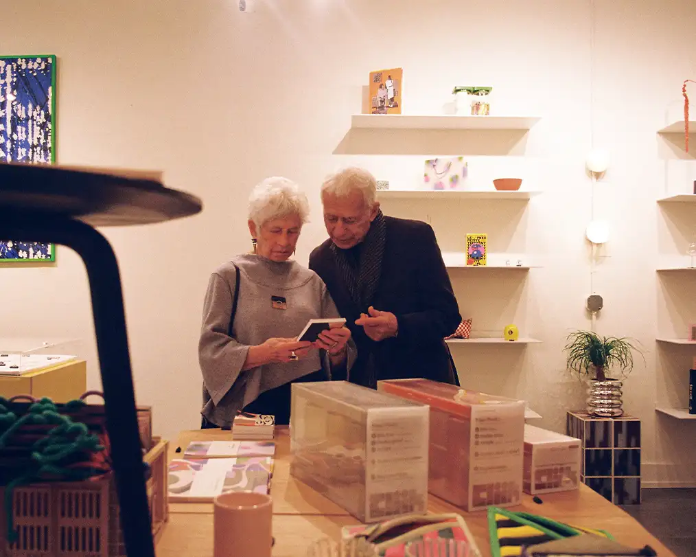 couple of grandparents looking at items in a store