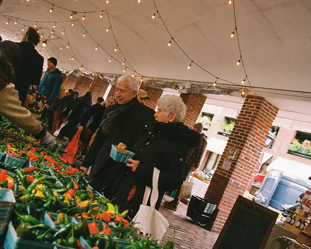 elderly couple at a chili market