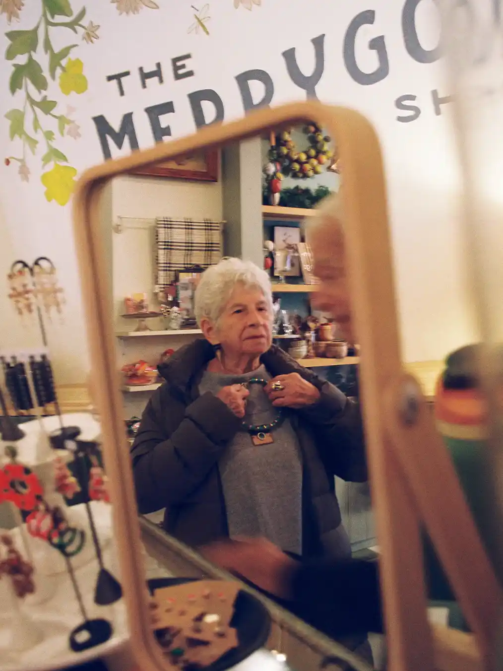 older adult looking in a mirror