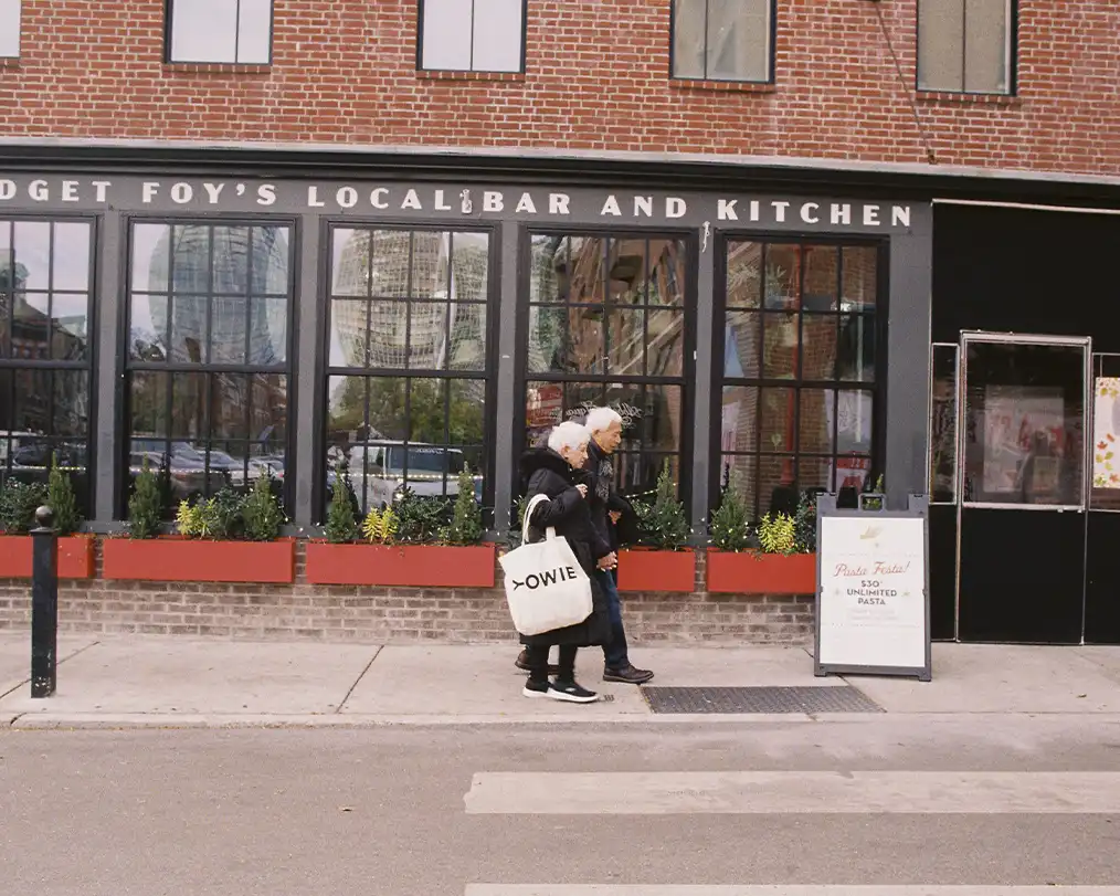 couple of adults walking on the street