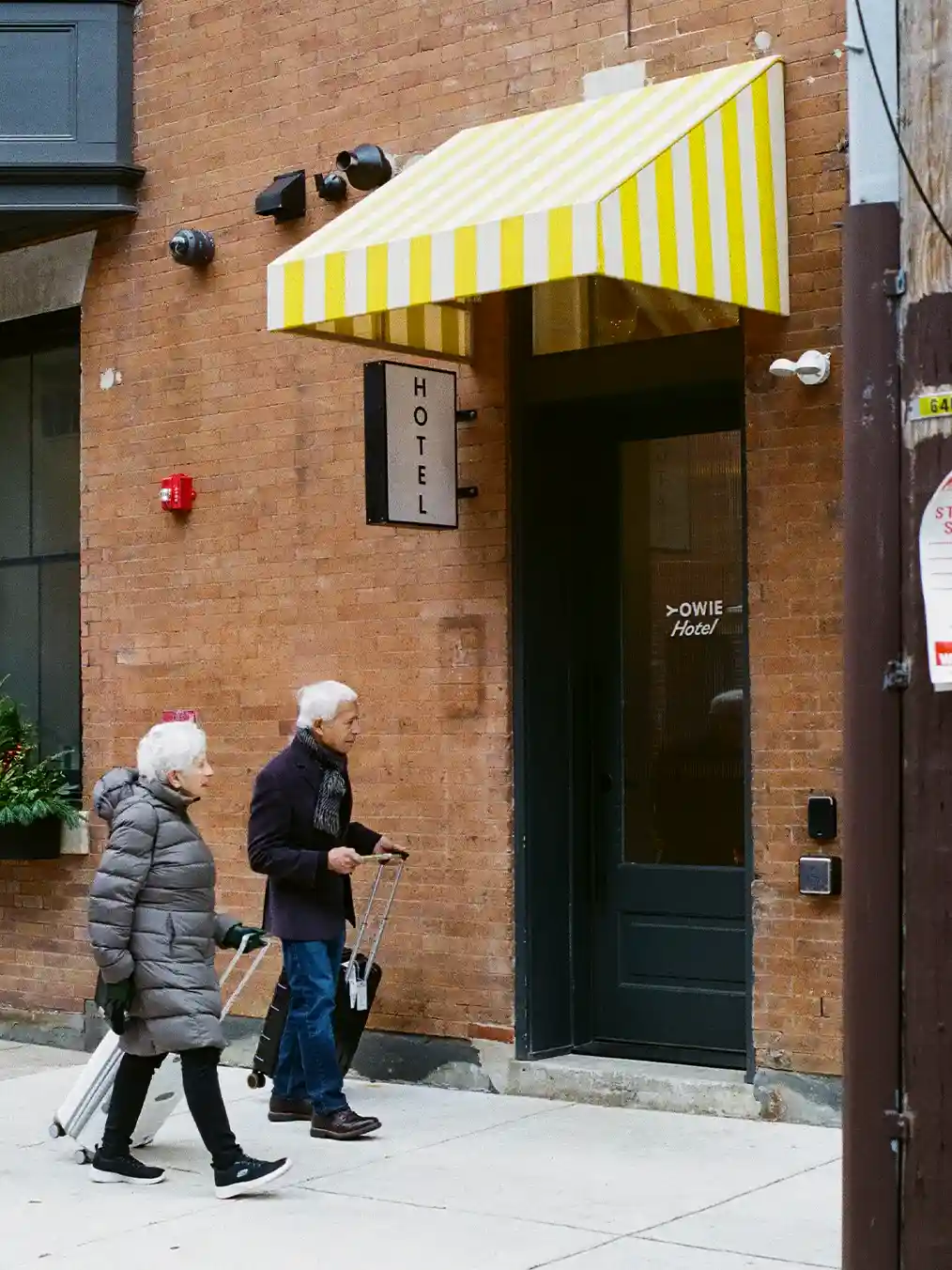 elderly couple entering a store
