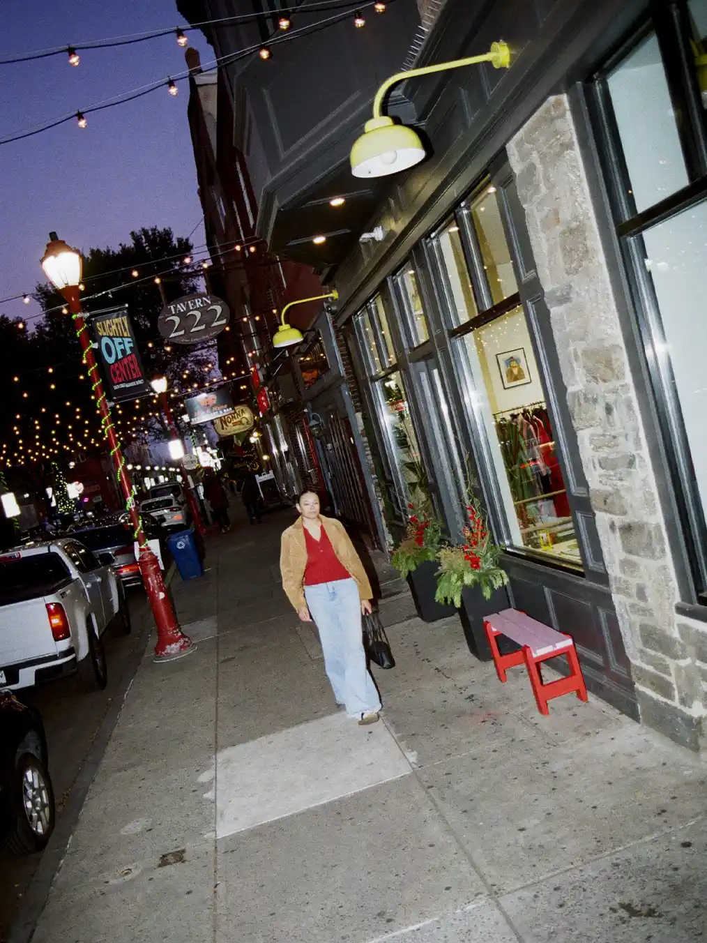 woman walking in the city at night