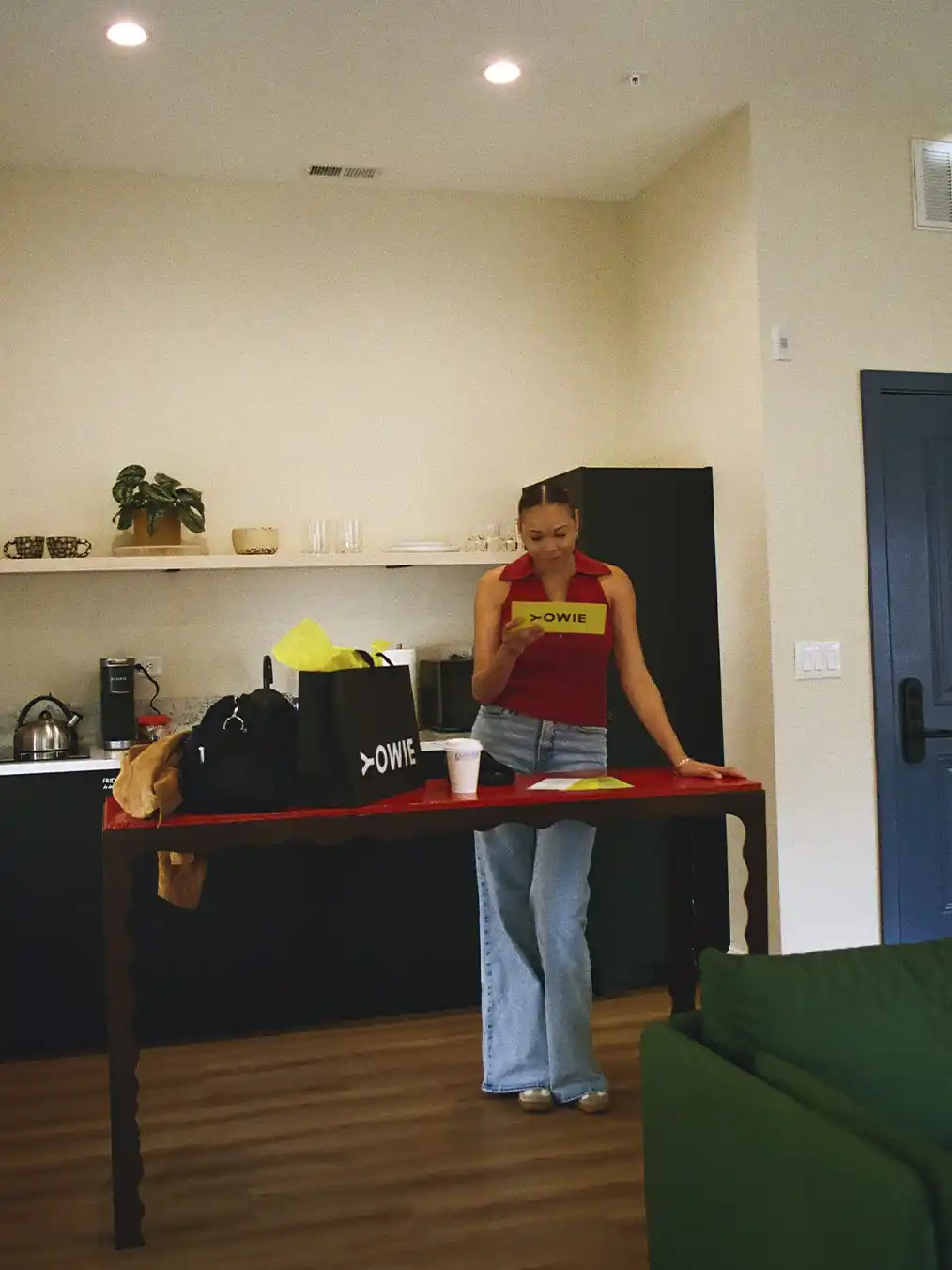 young woman reading something in her apartment