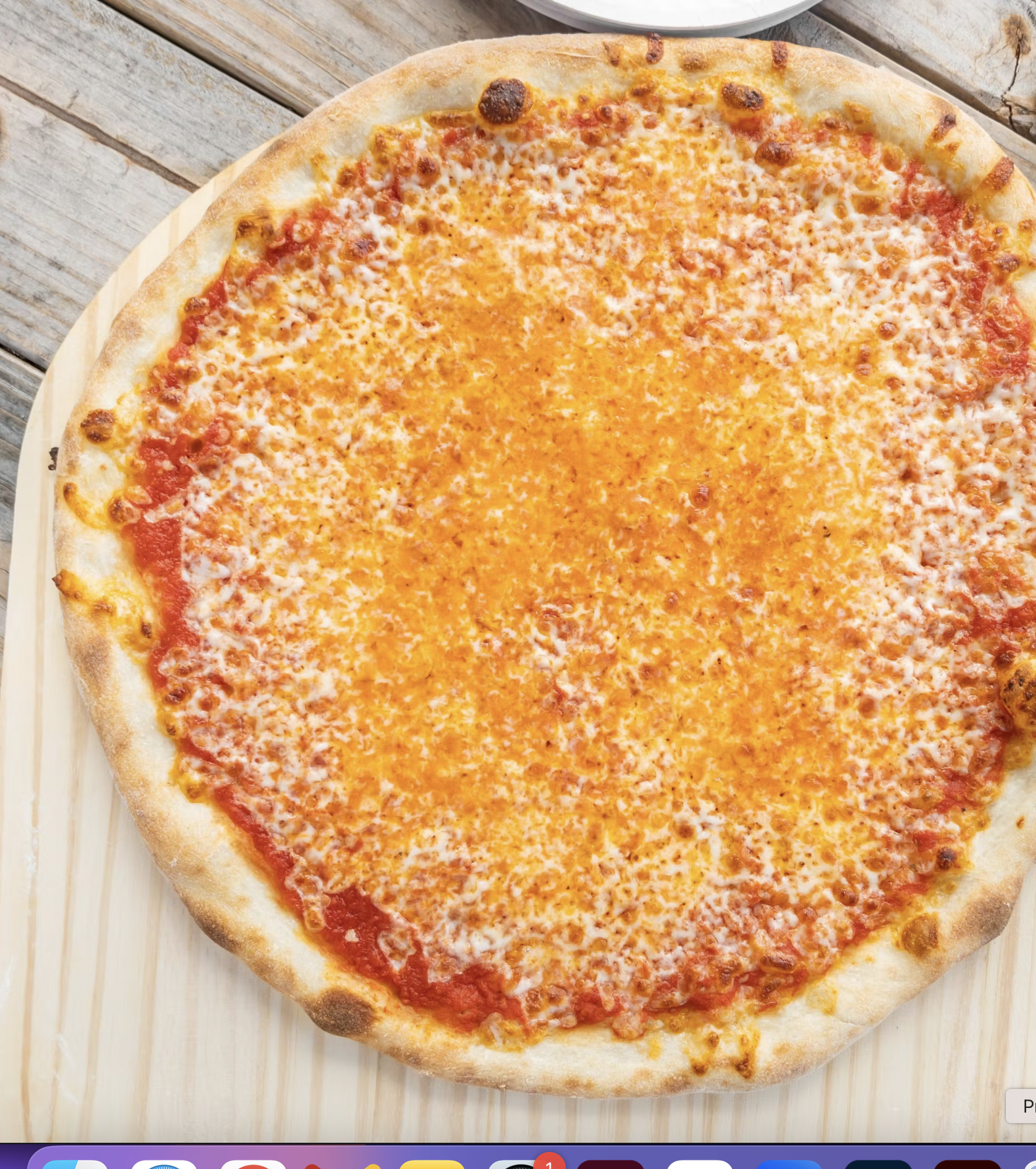 A round cheese pizza with a thin crust, topped with tomato sauce and an even layer of melted, lightly browned cheese, served on a white plate.